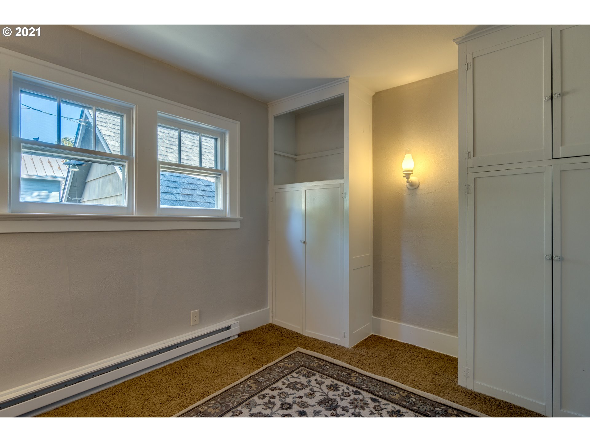 1928 Southwest 6th Avenue Camas, WA 98607 - Photo 21 of 31 an empty room with wooden floor and windows