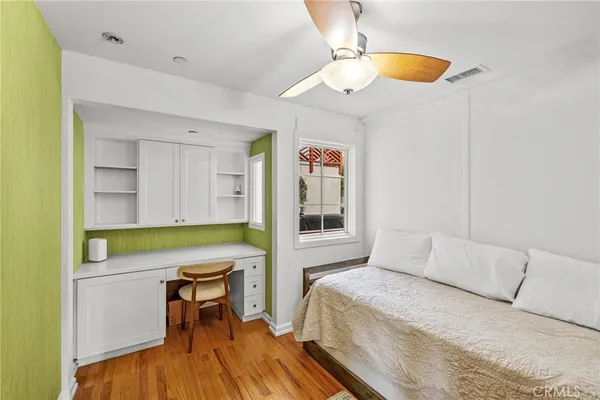 a bedroom with a bed and a table