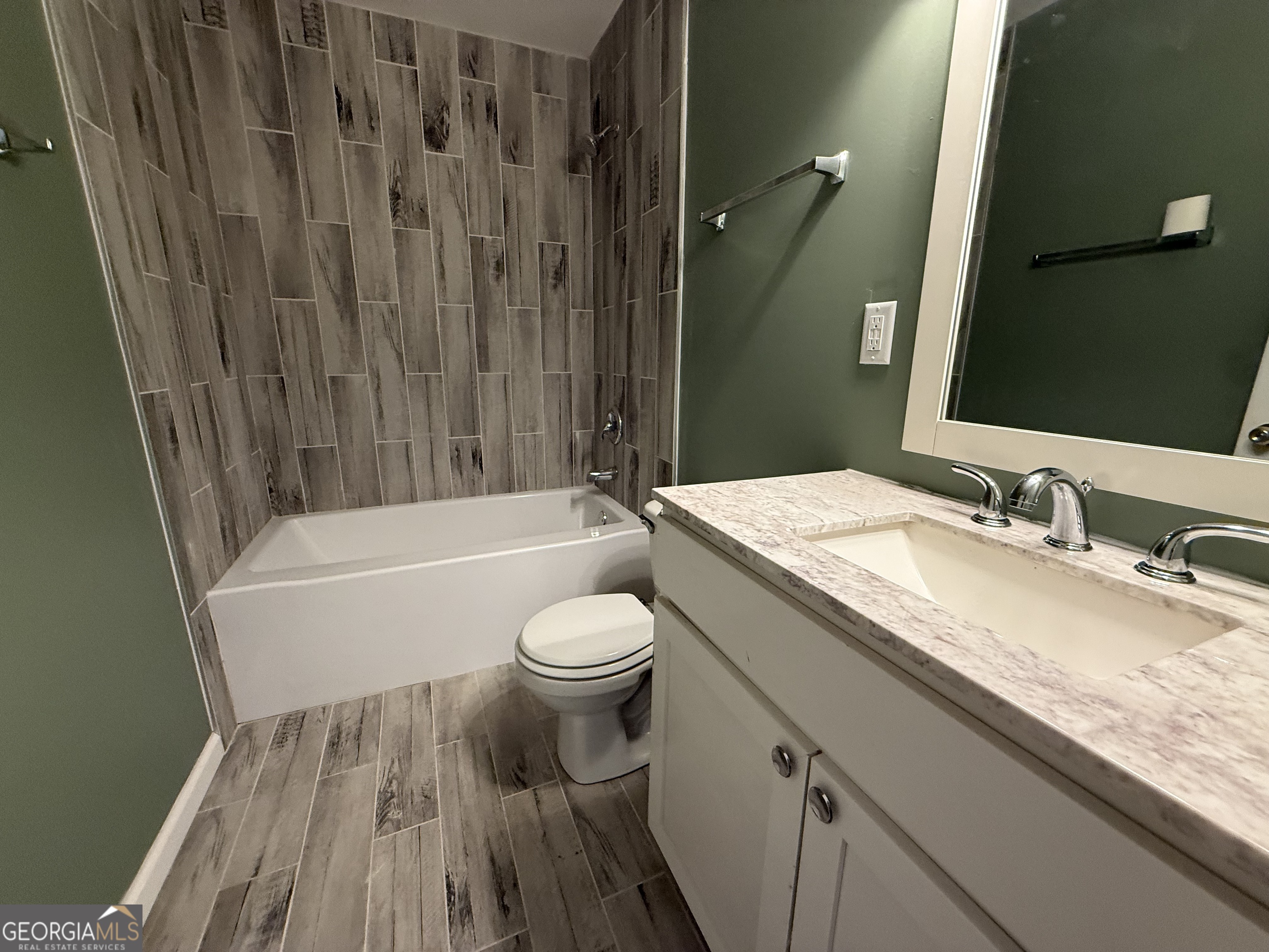 240 Sims Street Barnesville, GA 30204 - Photo 16 of 25 a bathroom with a granite countertop sink toilet and shower