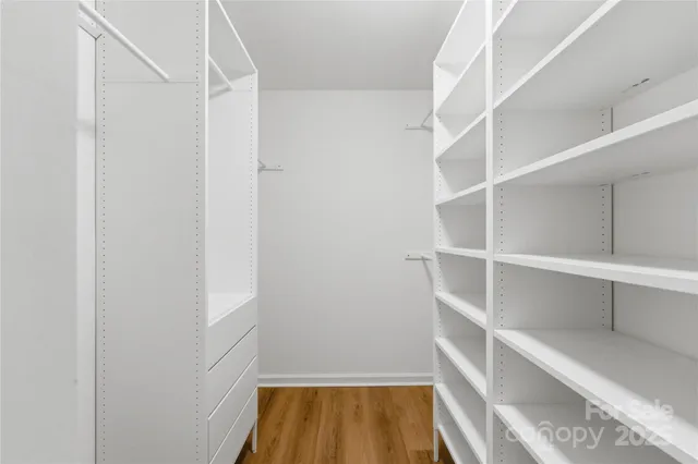 a view of an empty walk in closet