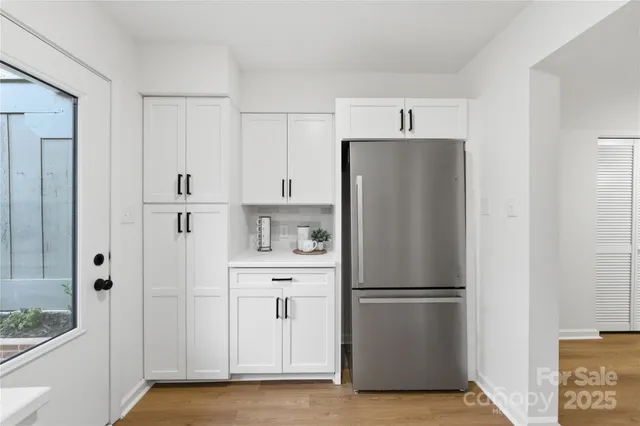 a refrigerator freezer sitting in a kitchen