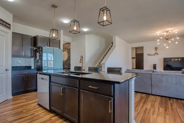 a kitchen with counter top space cabinets and stainless steel appliances