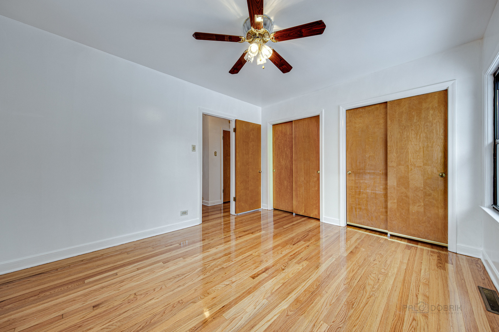 534 Longcommon Road Riverside, IL 60546 - Photo 14 of 30 wooden floor in an empty room with a window