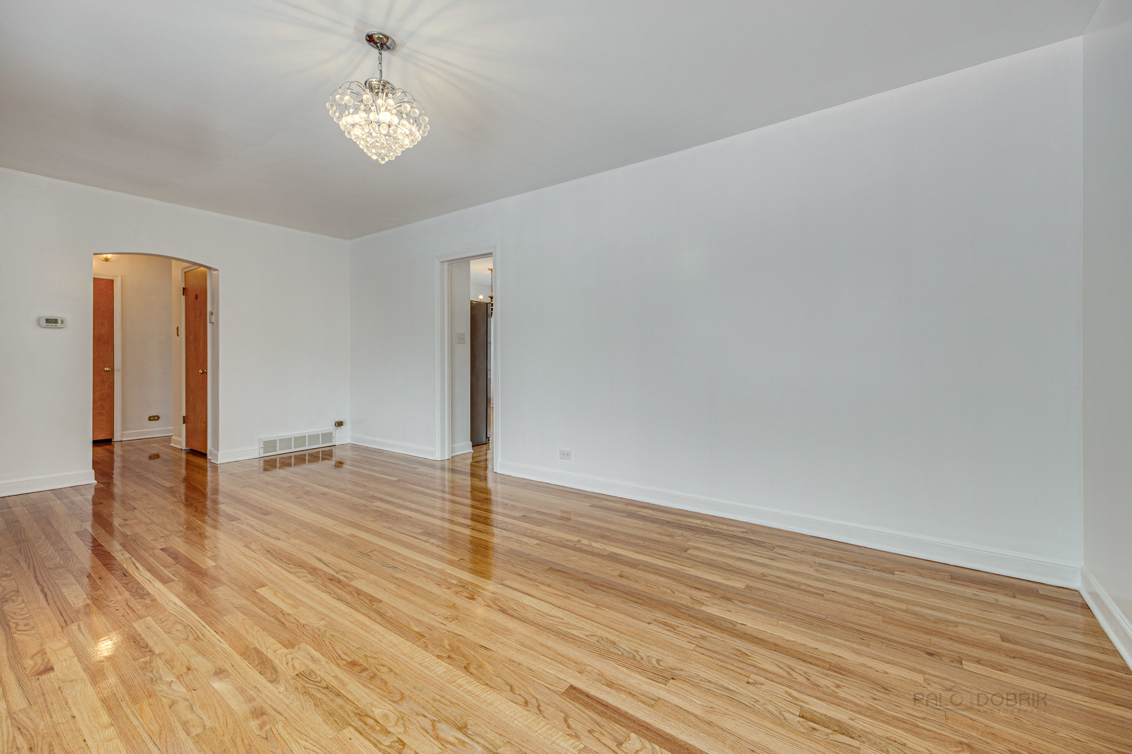 534 Longcommon Road Riverside, IL 60546 - Photo 4 of 30 a view of a livingroom with a chandelier