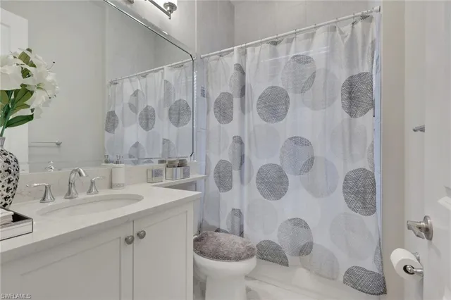 a bathroom with a sink and toilet