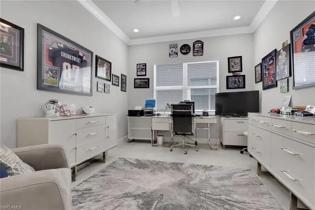 a bed room with furniture and window