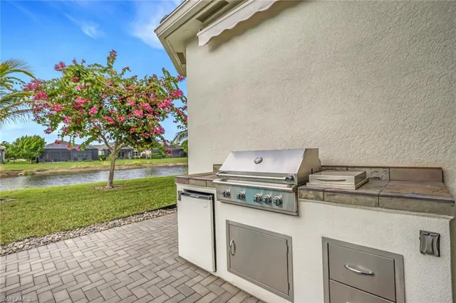 a stove top oven sitting inside of a kitchen