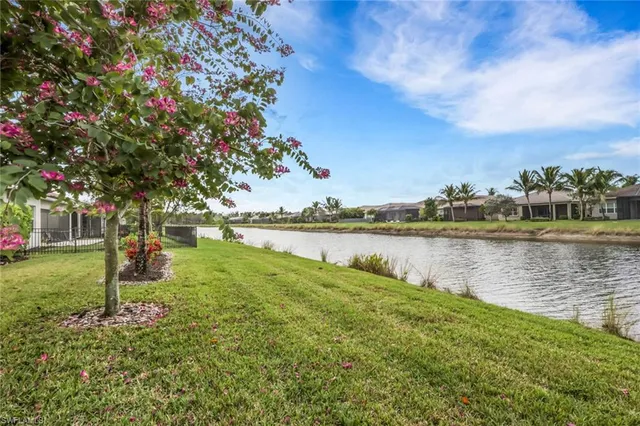 a view of a lake with a house in the background