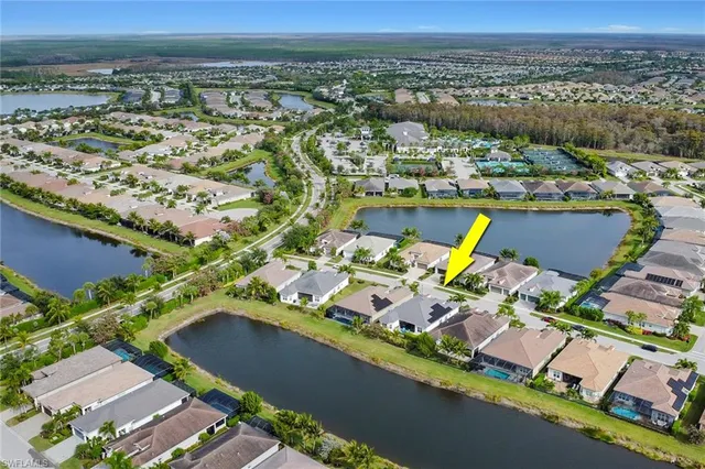 an aerial view of a house with a ocean view