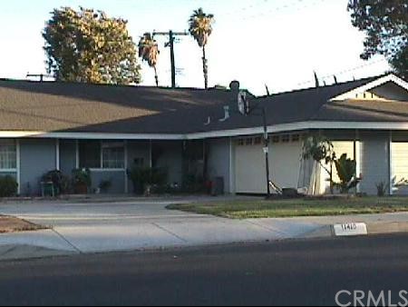 11410 Gramercy Place Riverside, CA 92505 - Photo 1 of 1 a front view of a house with a yard and garage