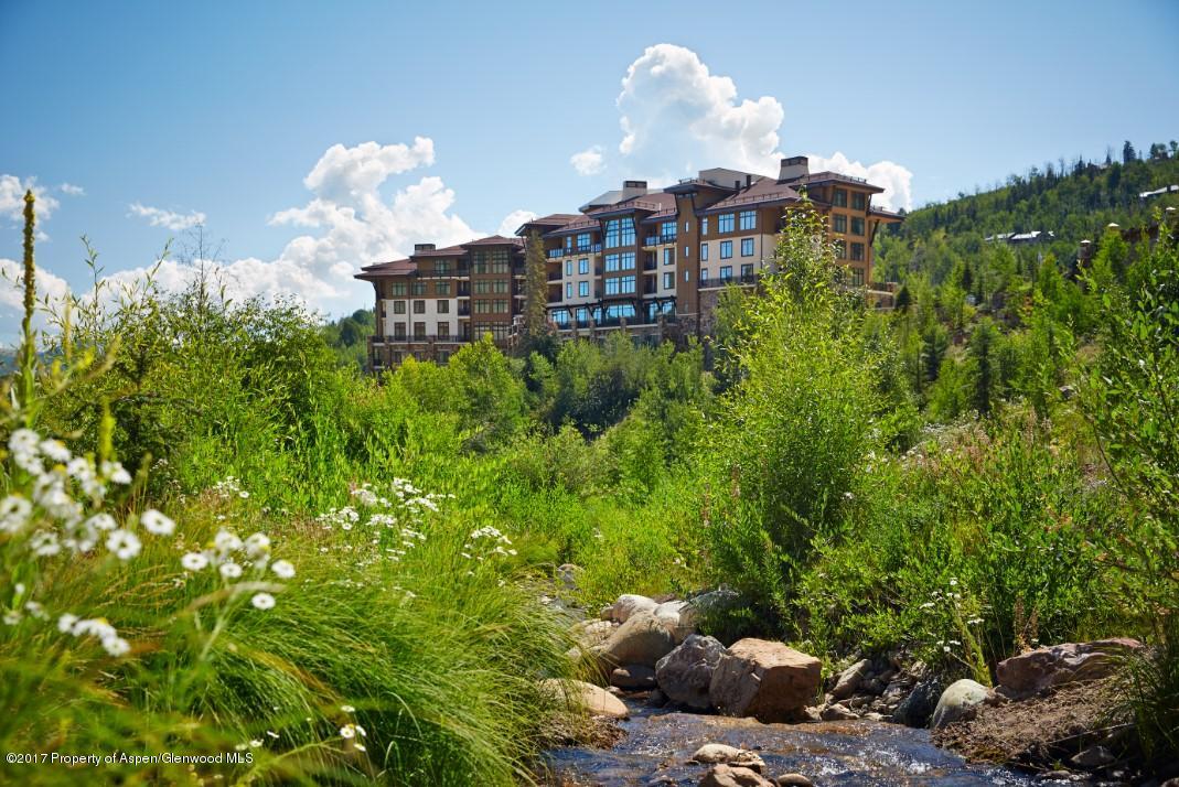 130 Wood Road, Unit 614 Snowmass Village, CO 81615 - Photo 11 of 11 a view of a house with a yard and a fountain