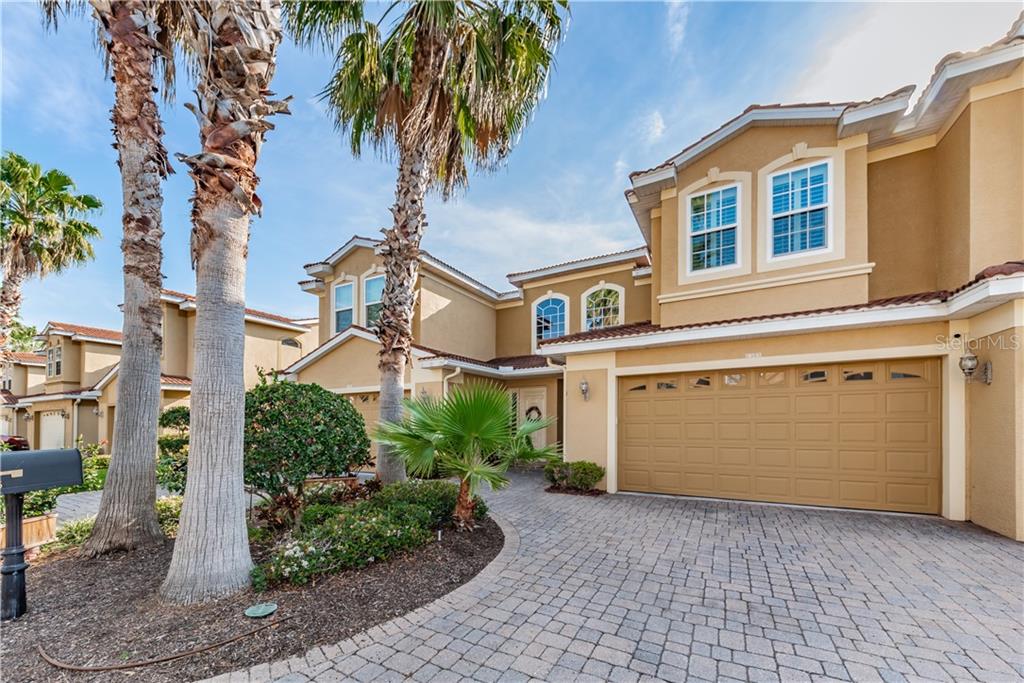1385 Ribolla Drive Palm Harbor, FL 34683 - Photo 1 of 1 a front view of a house with a yard and garage