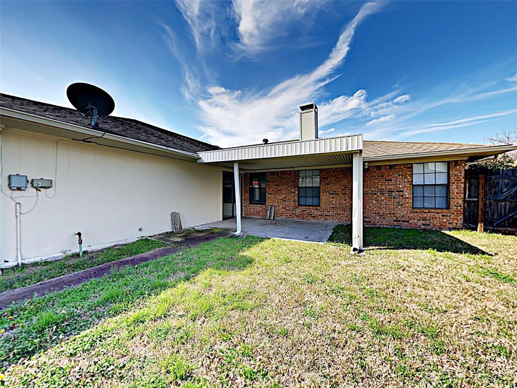 4726 Berridge Lane Dallas, TX 75227 - Photo 12 of 12 a view of a house with backyard and porch