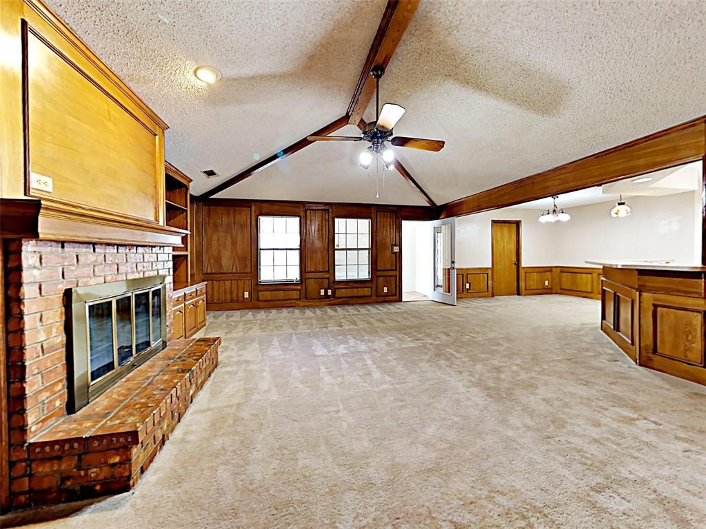 4726 Berridge Lane Dallas, TX 75227 - Photo 2 of 12 a view of an entryway with a fireplace