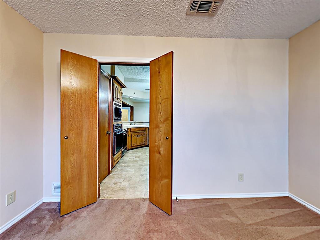 4726 Berridge Lane Dallas, TX 75227 - Photo 6 of 12 a view of a hallway view with wooden floor and a living room