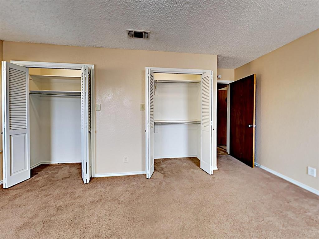 4726 Berridge Lane Dallas, TX 75227 - Photo 7 of 12 a view of an empty room with closet and a window