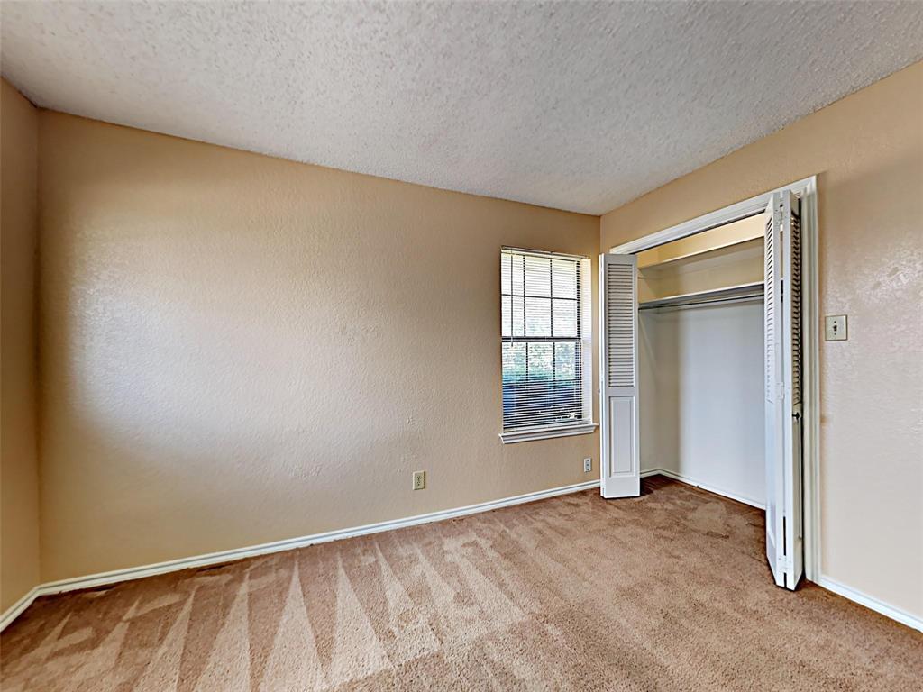4726 Berridge Lane Dallas, TX 75227 - Photo 8 of 12 an empty room with windows