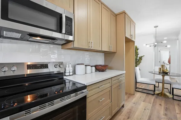 a kitchen with a stove and a microwave