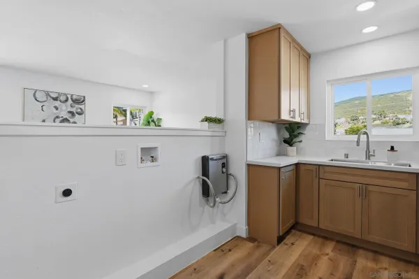 a kitchen with a sink and cabinets