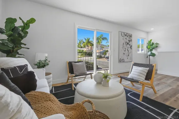 a balcony with furniture and a potted plant