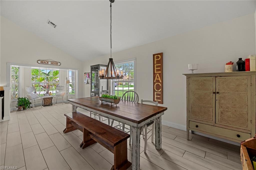 21778 Brixham Run Loop Estero, FL 33928 - Photo 14 of 48 a living room with furniture a window and appliances
