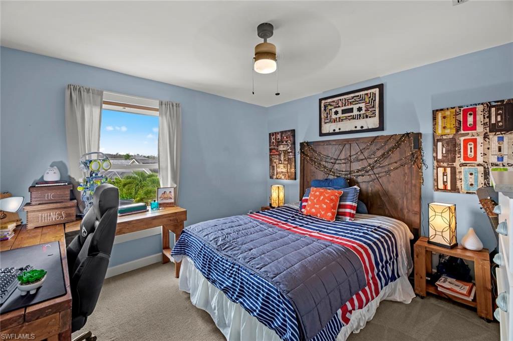 21778 Brixham Run Loop Estero, FL 33928 - Photo 20 of 48 a bedroom with a bed and a window