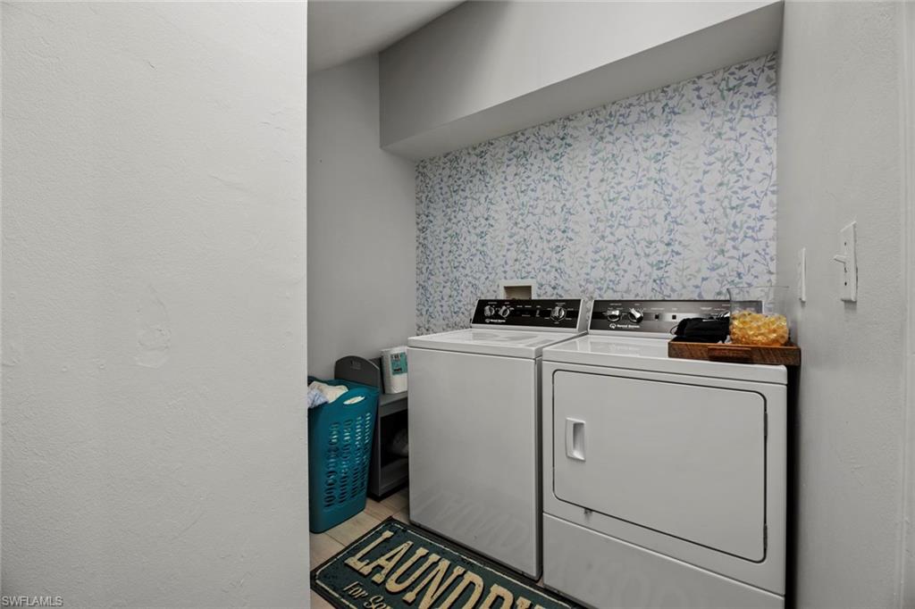 21778 Brixham Run Loop Estero, FL 33928 - Photo 25 of 48 a utility room with dryer and washer
