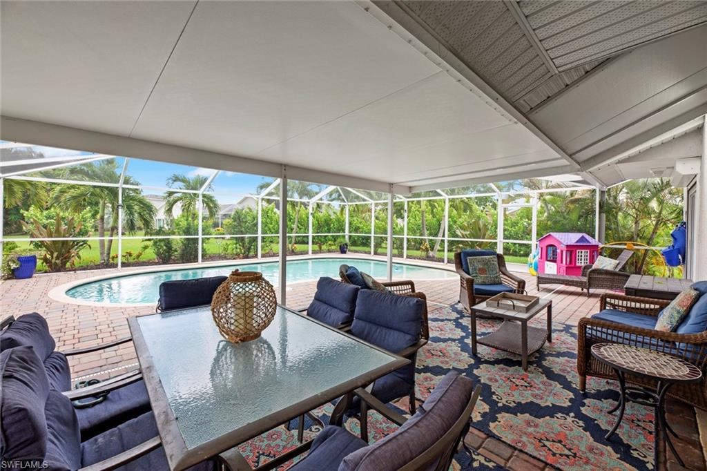 21778 Brixham Run Loop Estero, FL 33928 - Photo 26 of 48 a view of a dining room with furniture wooden floor and a potted plant