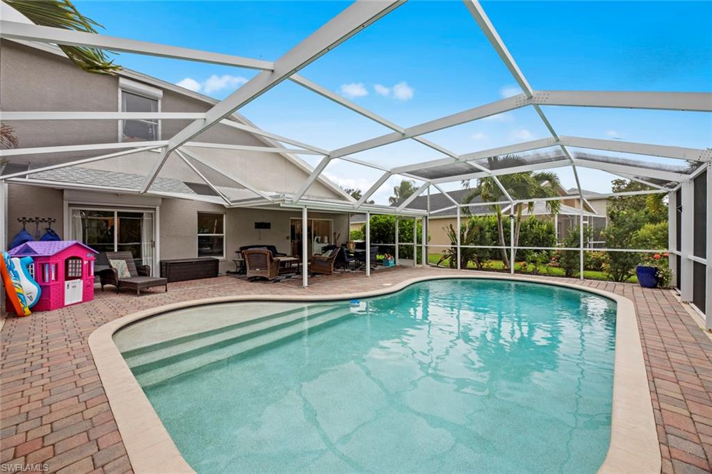 21778 Brixham Run Loop Estero, FL 33928 - Photo 31 of 48 a view of a swimming pool with a patio