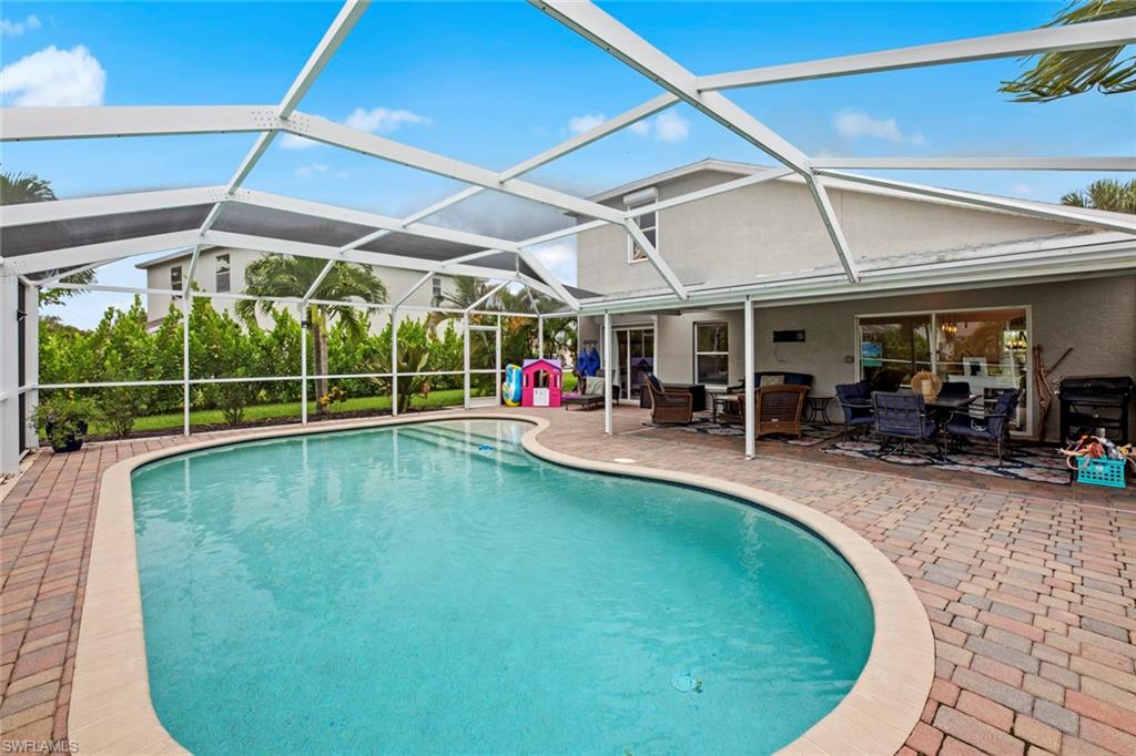 21778 Brixham Run Loop Estero, FL 33928 - Photo 32 of 48 a view of swimming pool with outdoor seating