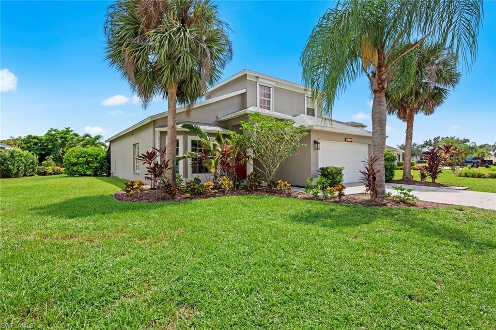 21778 Brixham Run Loop Estero, FL 33928 - Photo 36 of 48 a front view of house with yard and outdoor seating