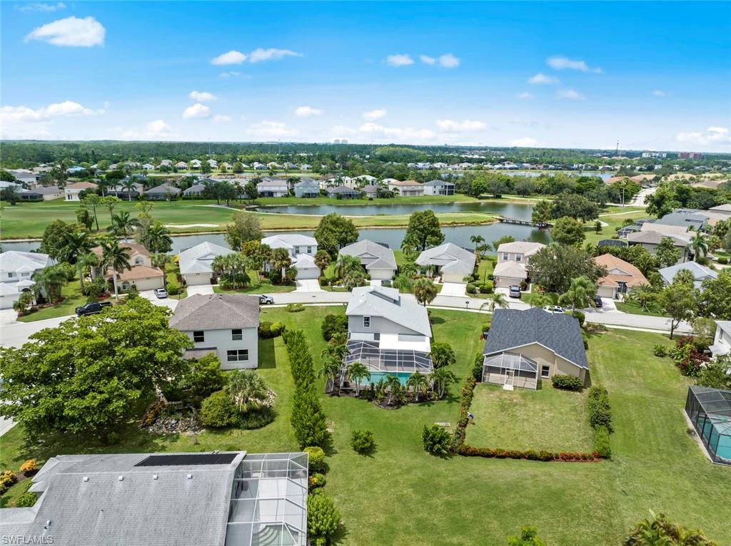 21778 Brixham Run Loop Estero, FL 33928 - Photo 41 of 48 an aerial view of a house with a yard and lake view