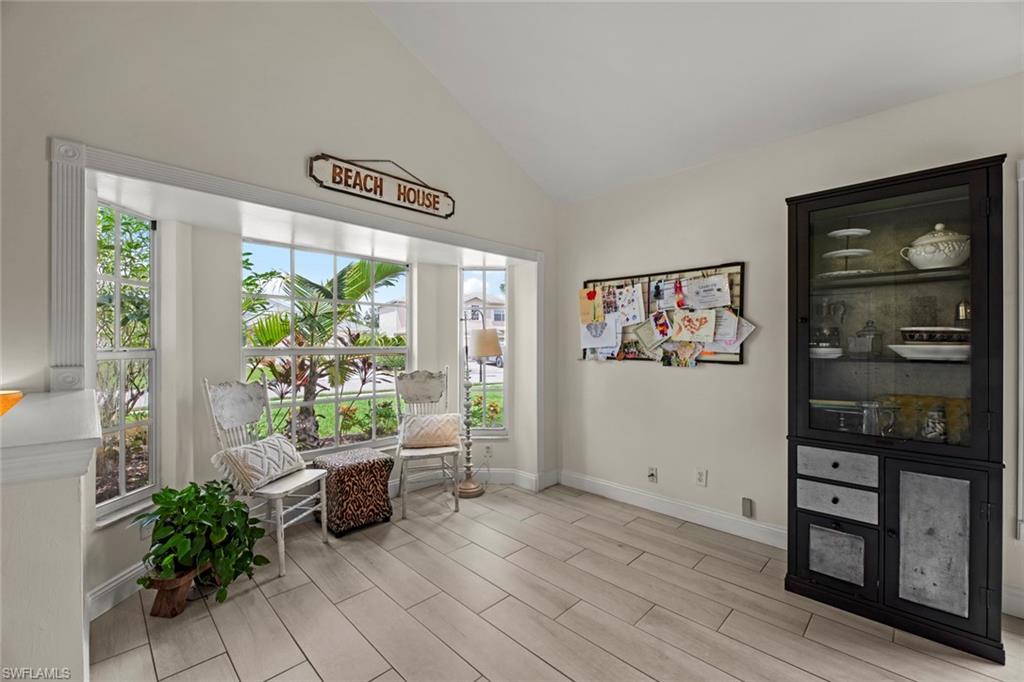 21778 Brixham Run Loop Estero, FL 33928 - Photo 9 of 48 a living room with furniture and a potted plant