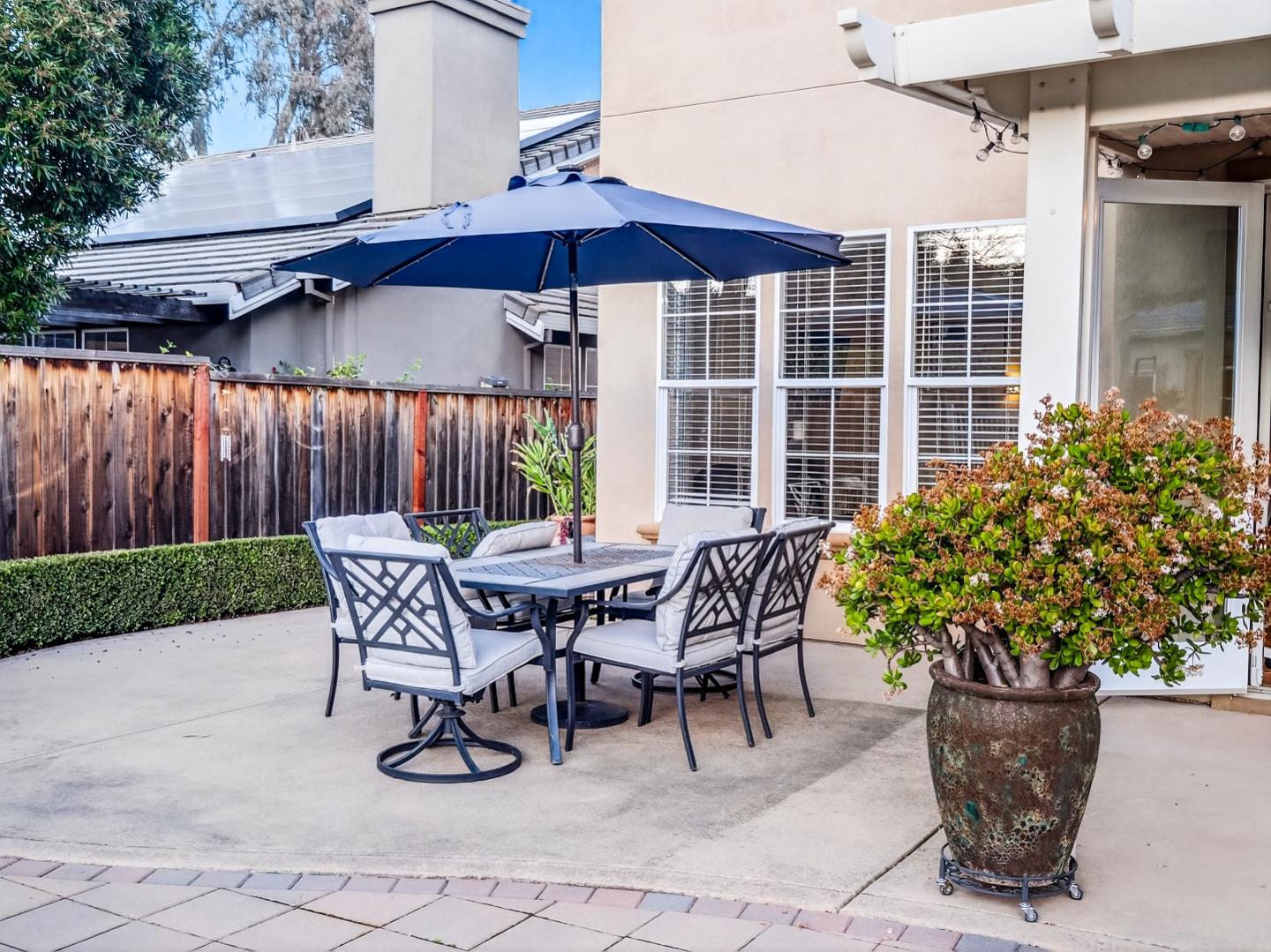 9123 Rancho Hills Drive Gilroy, CA 95020 - Photo 13 of 26 a patio with a table and chairs
