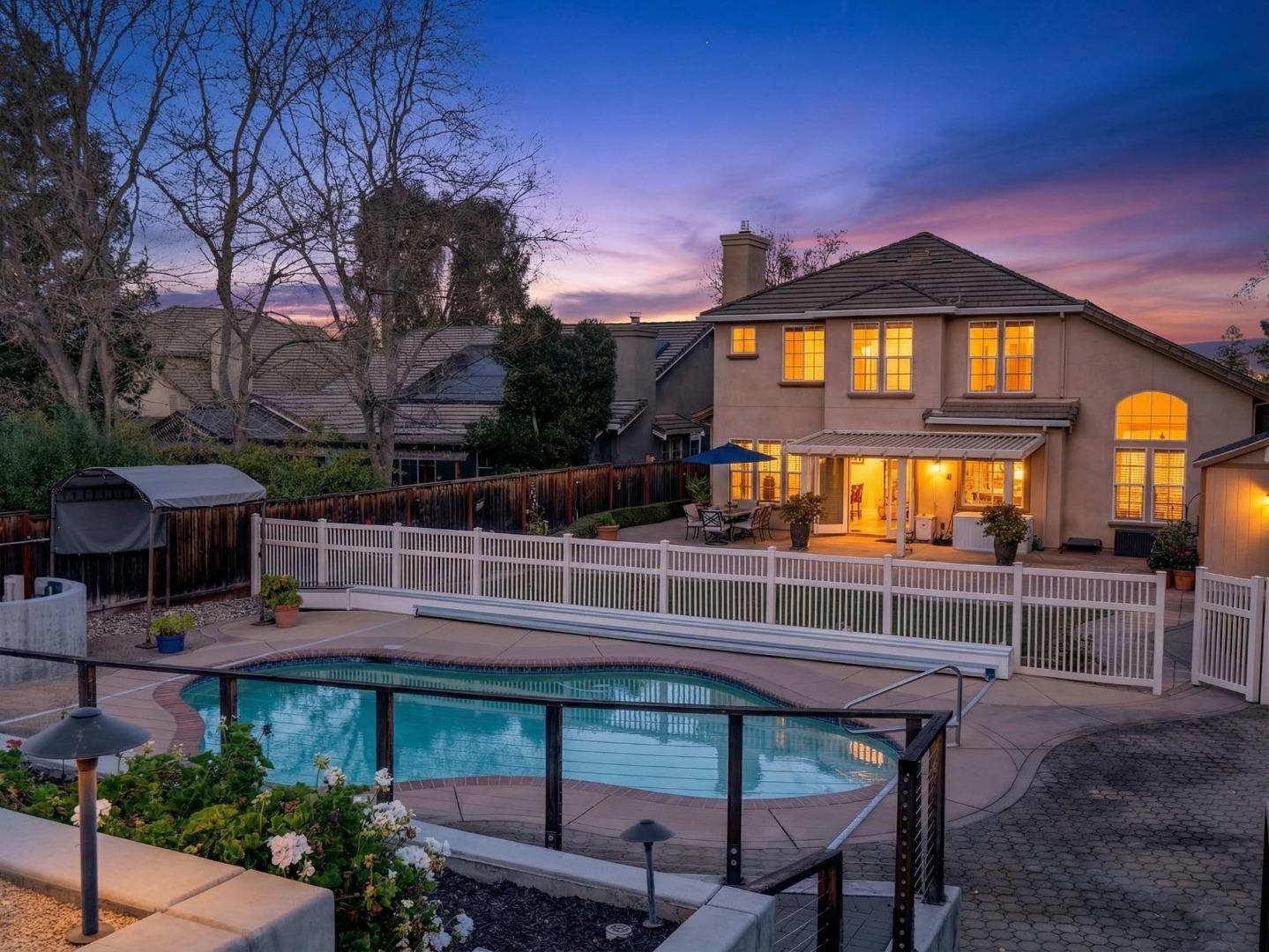 9123 Rancho Hills Drive Gilroy, CA 95020 - Photo 18 of 26 a view of a brick house with a yard