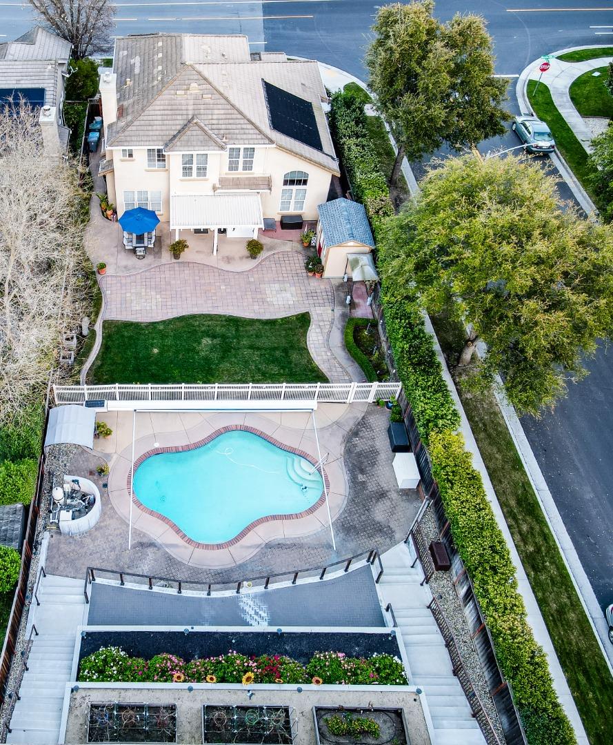 9123 Rancho Hills Drive Gilroy, CA 95020 - Photo 22 of 26 an aerial view of a house with a yard and potted plants