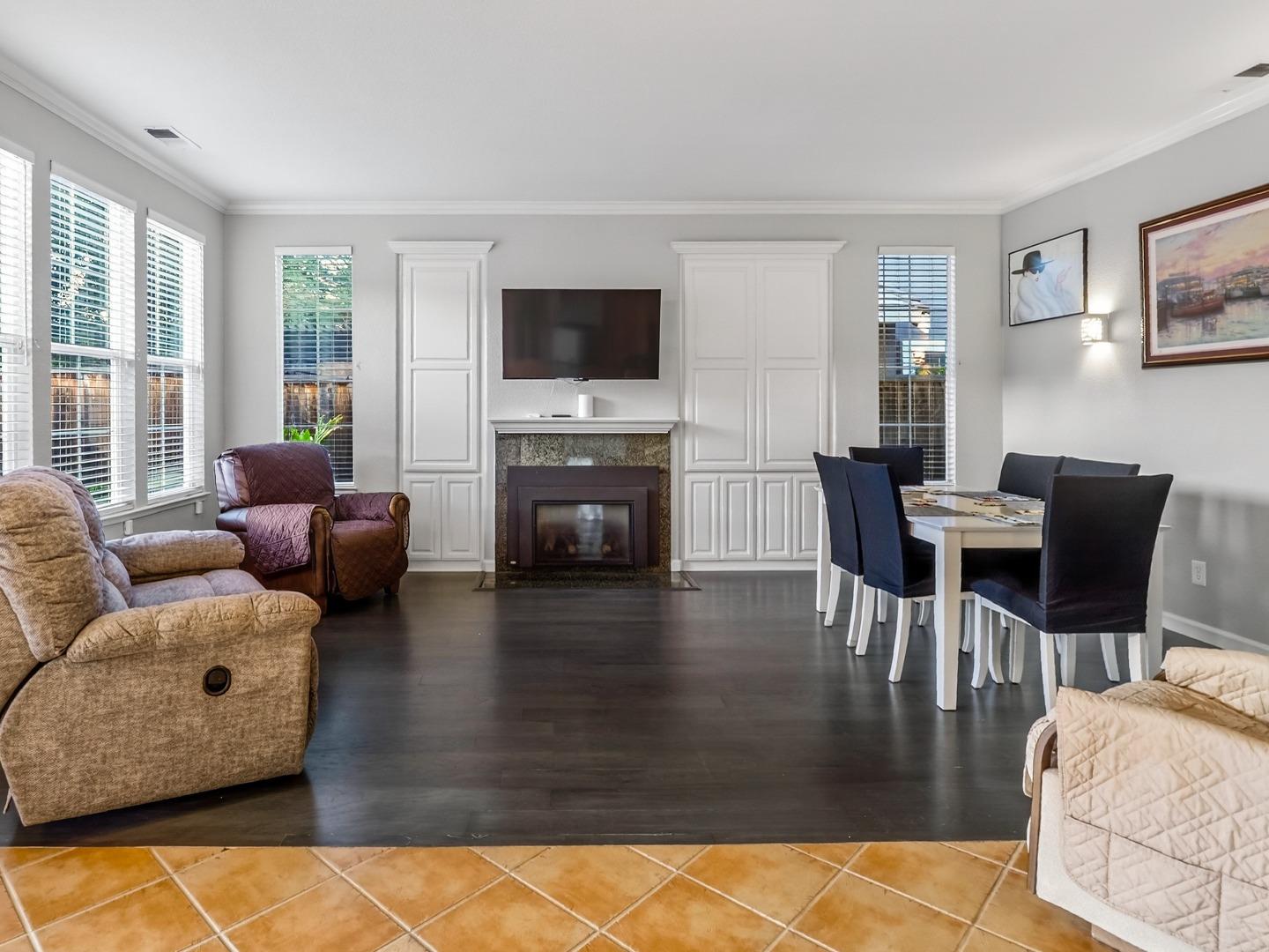 9123 Rancho Hills Drive Gilroy, CA 95020 - Photo 3 of 26 a living room with furniture and a flat screen tv