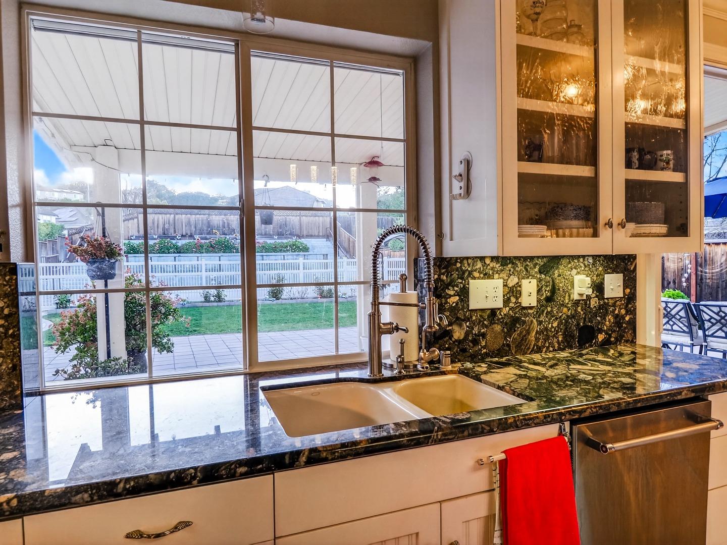 9123 Rancho Hills Drive Gilroy, CA 95020 - Photo 6 of 26 a kitchen with a sink and a large window