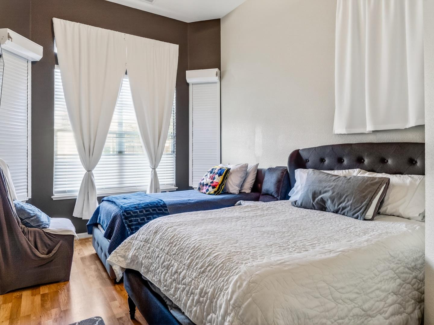 9123 Rancho Hills Drive Gilroy, CA 95020 - Photo 10 of 26 a bedroom with double bed and a window