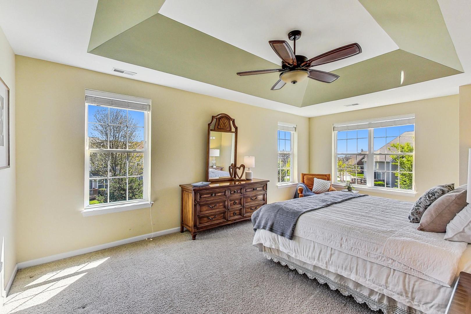 1224 Falcon Ridge Drive Elgin, IL 60124 - Photo 12 of 27 a bedroom with a bed a window and a ceiling fan