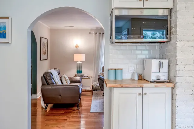 a living room with fireplace furniture and a flat screen tv