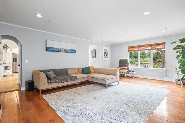 a living room with furniture and a rug