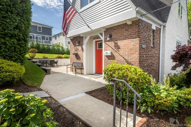 a front view of a house with garden