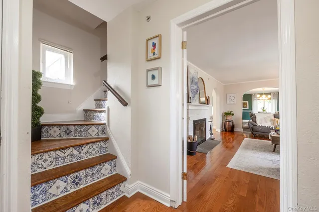 a spacious bedroom with a bed and a chandelier