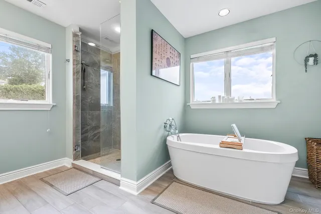 a view of a hallway with wooden floor and closet area