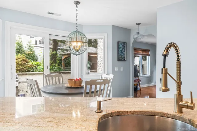 a spacious bathroom with a sink and a mirror