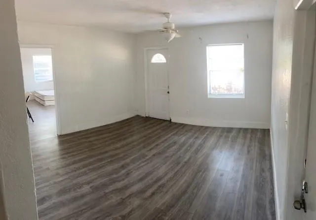 a swimming pool with outdoor seating and yard