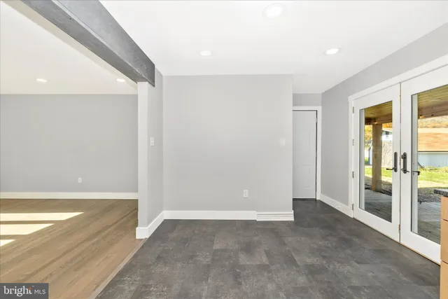 a large kitchen with stainless steel appliances granite countertop a refrigerator and a stove top oven