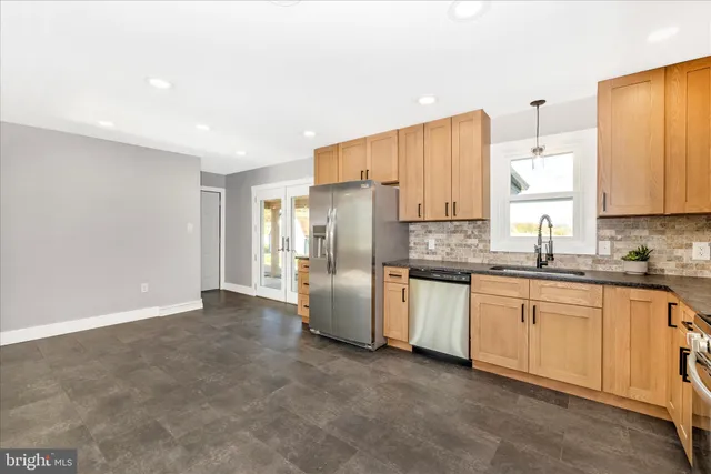 a view of room with window and wooden floor