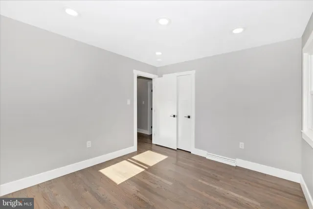 a bathroom with a double vanity sink toilet and shower